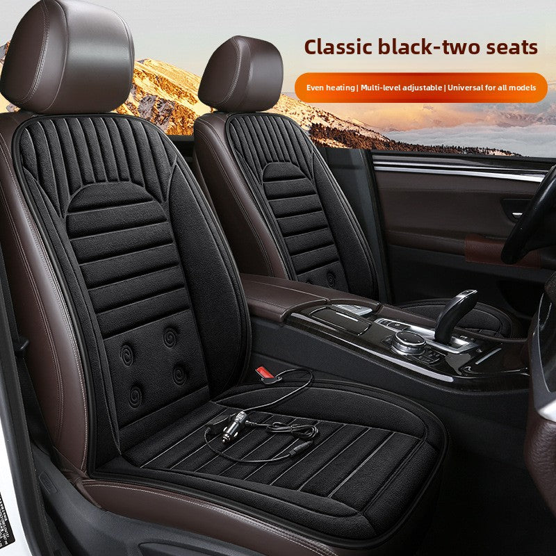 Black car seat covers in a vehicle interior, mountain landscape in the background.