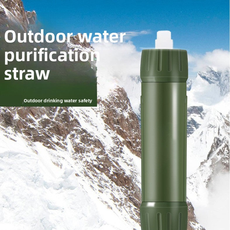 Green outdoor water purification straw with mountainous background