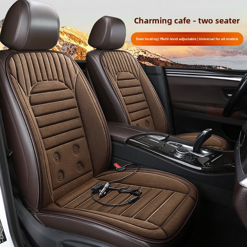 Brown car seat covers with heating function in a vehicle interior, mountain landscape in the background.