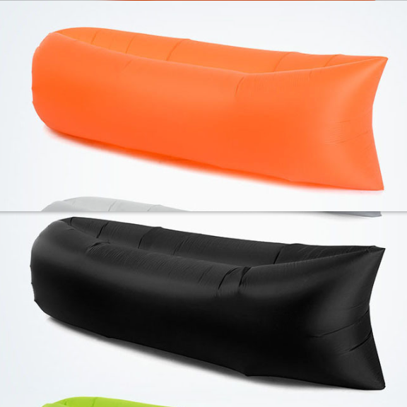 Orange and black inflatable lounge sofas on a white background