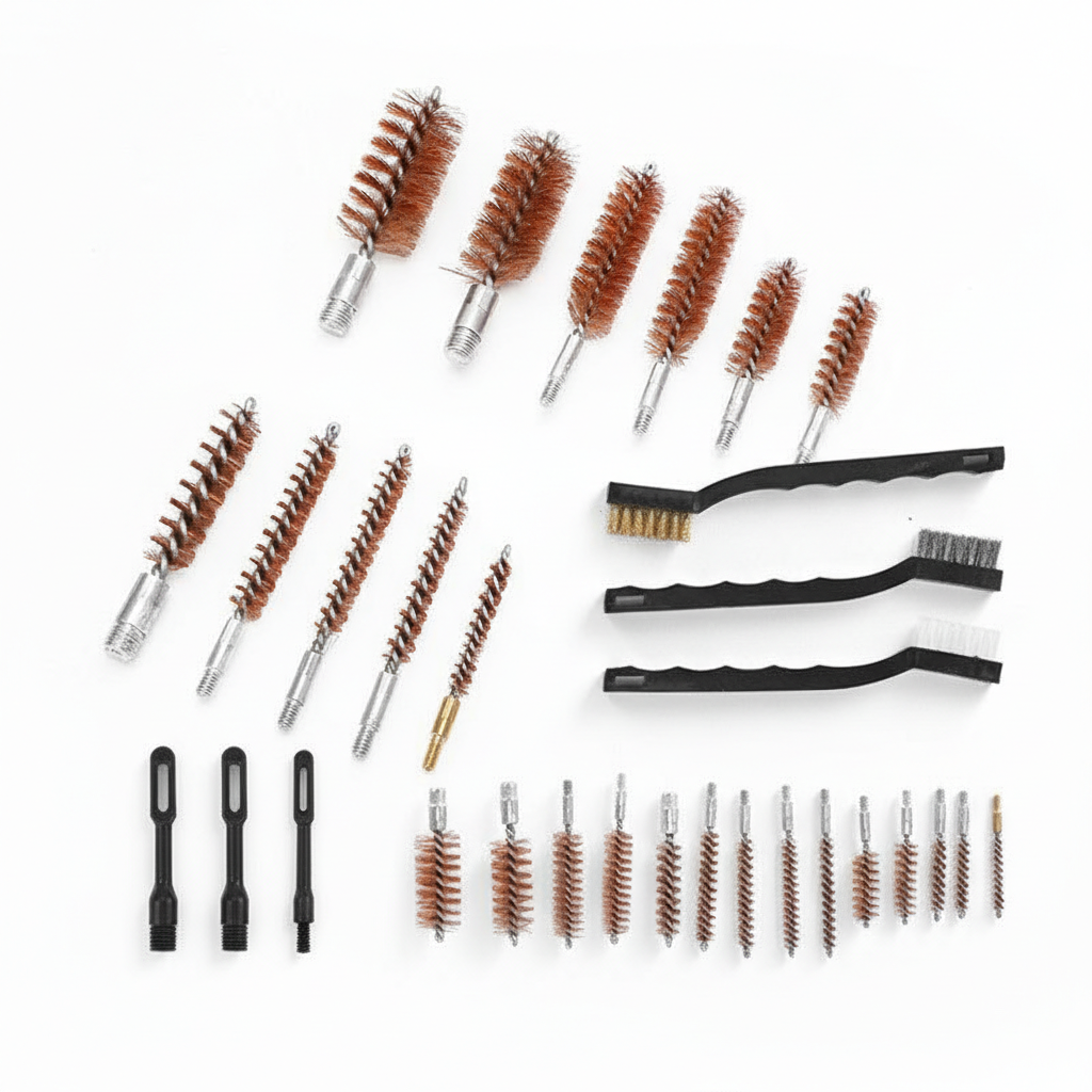 Collection of gun cleaning brushes and tools on a white background